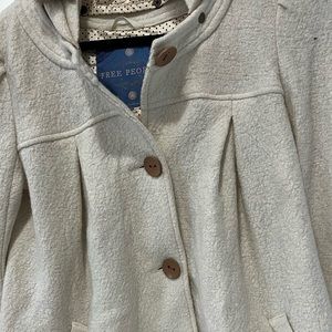 Free People Peacoat w hood. It’s lined.